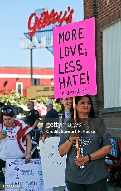 Uzma Ali of Richardson, Texas holds a protest sign outside a rally for Republican presidential candidate Donald Trump at at Gilley's on June 16, 2016...