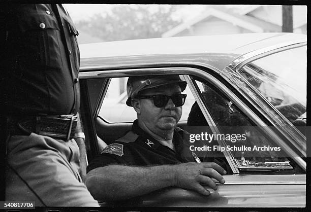 Al Lingo, ardent segregationist and public safety Director of the Alabama highway department, rides in a car near the Montgomery High School. Lingo,...