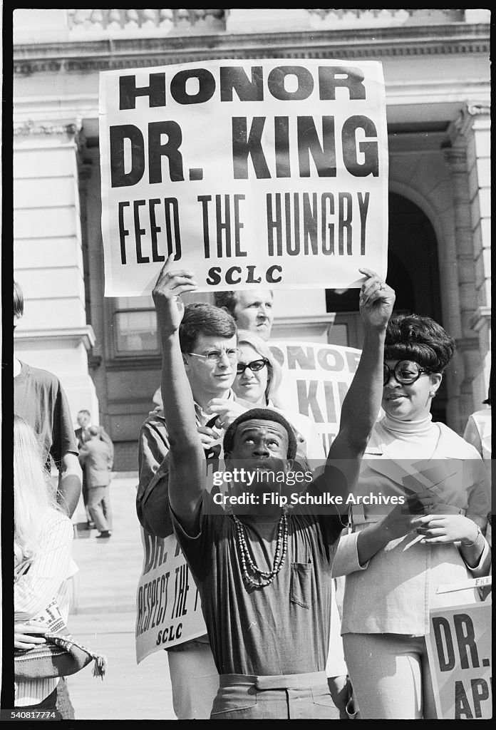 Civil Rights Movement Rally Civil rights activists carry picket signs on the steps of a... News ...