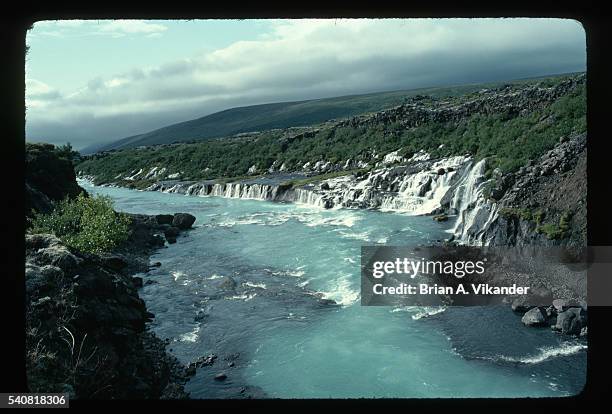 cascades of hraunfossar - hraunfossar stock pictures, royalty-free photos & images