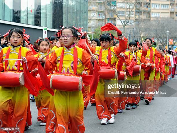 Group of kids performing with percussion instruments during Chinese New Year Celebration, Barcelona, Spain, February 21, 2015