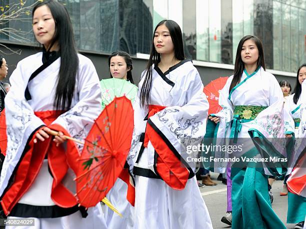 Chinese girls wearing traditional dresses during Chinese New Year Celebration, Barcelona, Spain, February 21, 2015