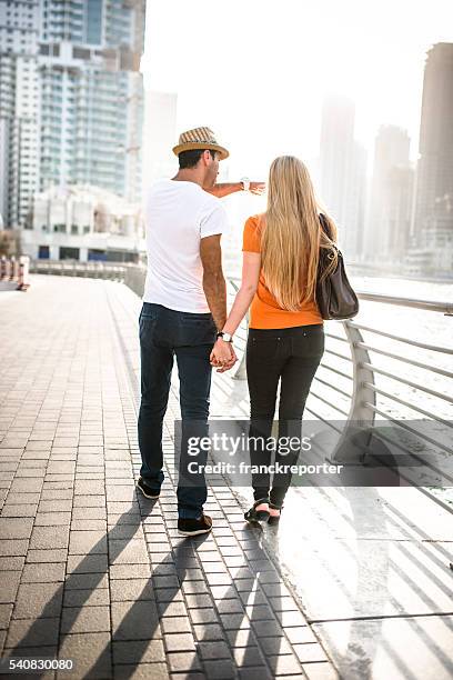togetherness couple in vacations on dubai marina - uae - city walk dubai stockfoto's en -beelden