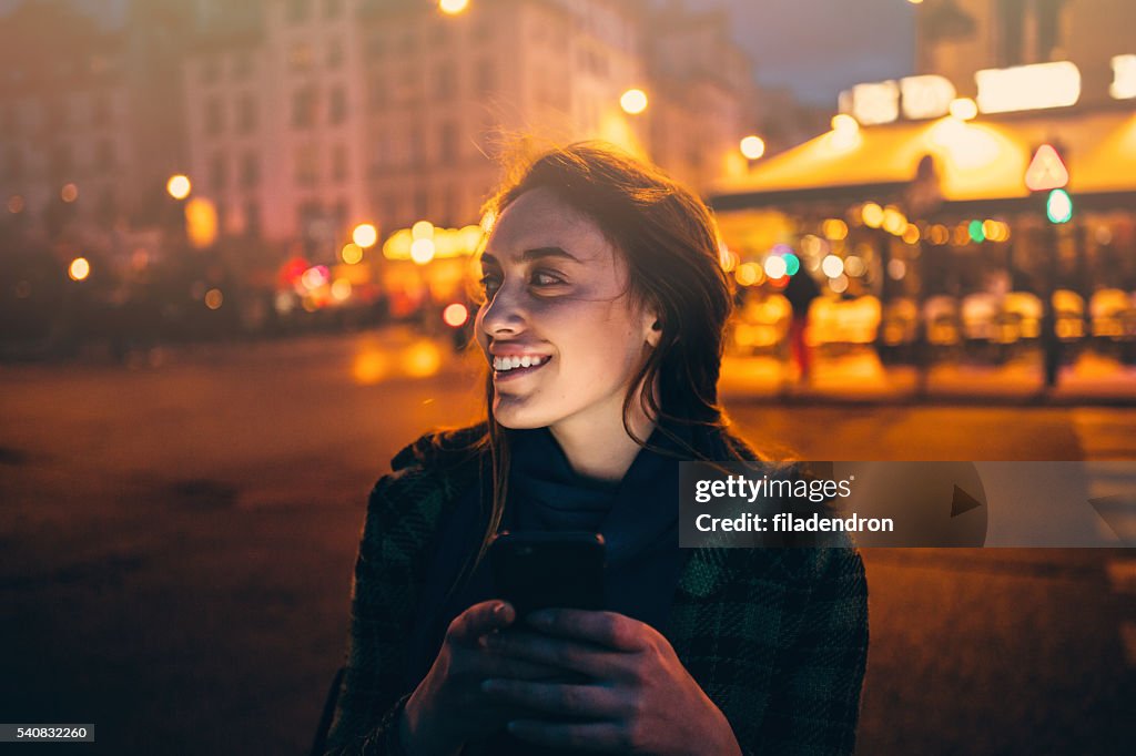 Woman texting at night