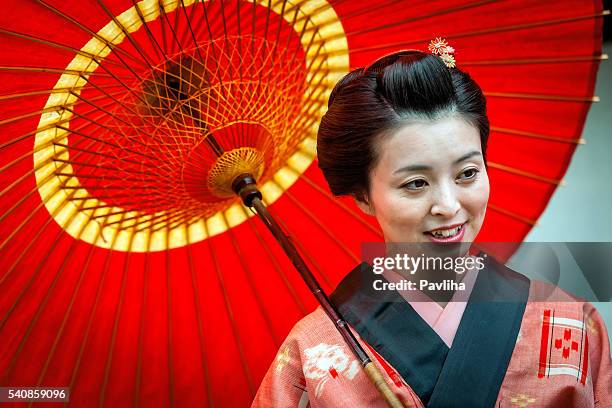 beautiful japanese woman with kimono in kyoto, japan - woman walks down street stock pictures, royalty-free photos & images