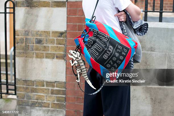 Guest wears a Miu Miu bag with a Coach Key Ring on day 4 of London Collections: Men on June 13, 2016 in London, England. Guest