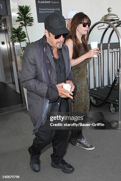 Al Pacino and Lucila Sola is seen at LAX on June 16, 2016 in Los Angeles, California.