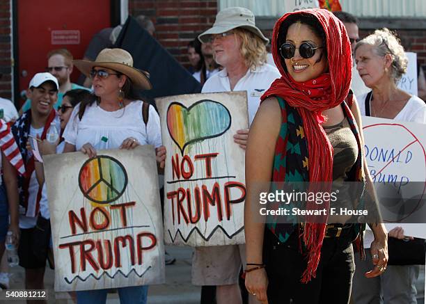 Reivin Alexandria of Dallas listens to leaders organize protesters outside a rally for Republican presidential candidate Donald Trump at at Gilley's...