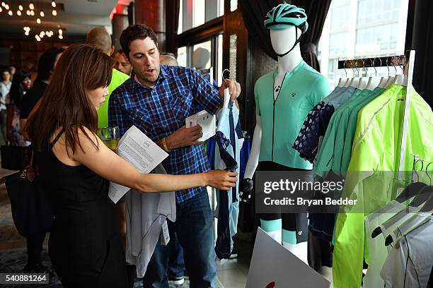 Gueats look at clothes at the Bontrager/Trek cycling display at the 37.5/Cocona Brand showcase event at Gansevoort Park Avenue on June 16, 2016 in...