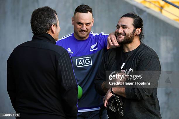 Ex-All Black Piri Weepu is distracted by Israel Dagg while talking to assistant coach Wayne Smith during a New Zealand All Blacks Captain's Run at...