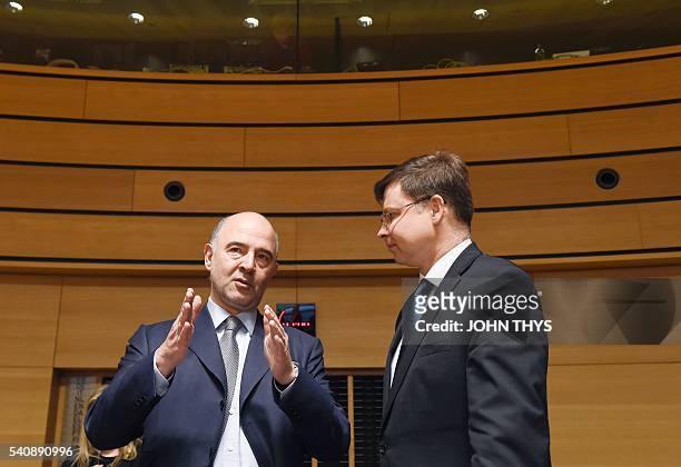 European Commissioner of Economic and Financial Affairs, Taxation and Customs Pierre Moscovici talks with Vice President of Euro and Social Dialogue...