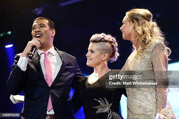 Comedian/actor Michael Yo, TV personality Kelly Osbourne, and dancer Kym Johnson attend the Babes for Boobs Bachelor Auction benefitting the Los...