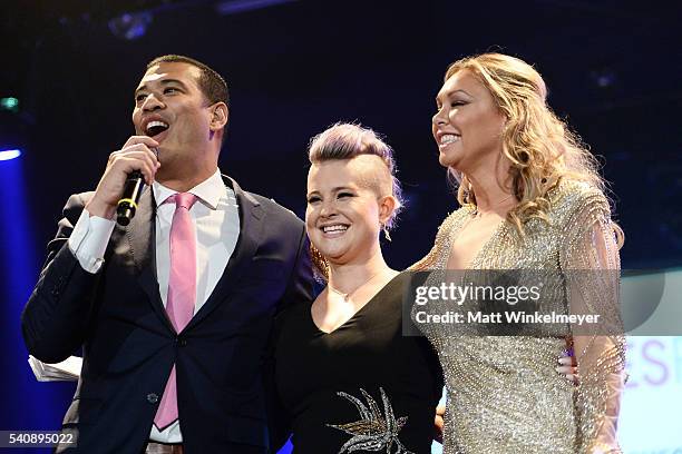 Comedian/actor Michael Yo, TV personality Kelly Osbourne, and dancer Kym Johnson attend the Babes for Boobs Bachelor Auction benefitting the Los...