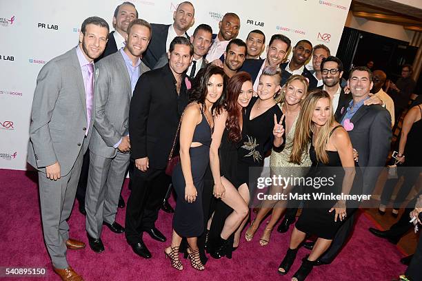 Niki Ostin, singer J Sutta, TV personality Kelly Osbourne, dancer Kym Johnson, and Jennifer Cohen pose for a photo with the participating Bachelors...