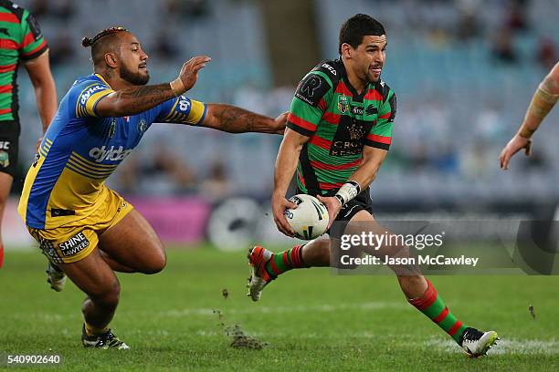 Cody Walker of the Rabbitohs is tackled by Kenny Edwards of the Eels during the round 15 NRL match between the South Sydney Rabbitohs and the...