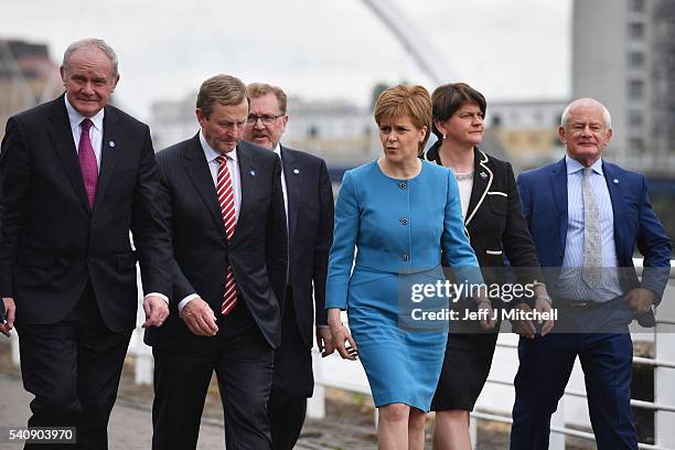 Nicola Sturgeon the First Minister of Scotland walks with Martin McGuinness deputy First Minister of Northern Ireland, Taoiseach Enda Kenny, Arlene...