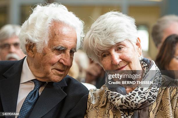 Holocaust survivors William E Glied and Hedy Bohm wait at the last day of the trial of former SS officer Reinhold Hanning at a court in Detmold,...