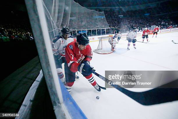 Tyler Gron of Canada protects the puck during the match between Team USA and Team Canada at Rod Laver Arena on June 17, 2016 in Melbourne, Australia.