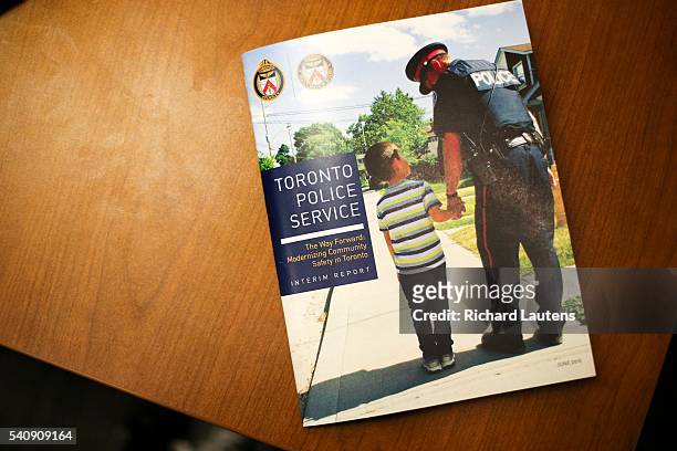 Copy of the report sits on a table. The Toronto Police Service released their interim report on their task force called The Way Forward: Modernizing...