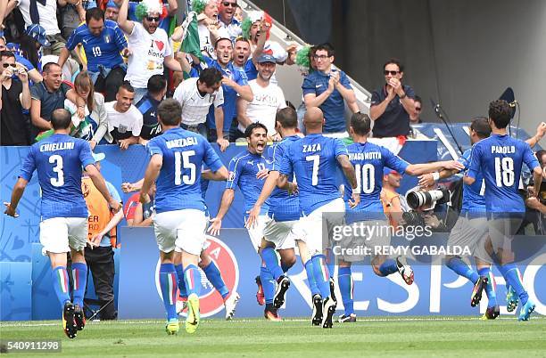 Italy's forward Citadin Martins Eder celebrates a goal with teammates during the Euro 2016 group E football match between Italy and Sweden at the...