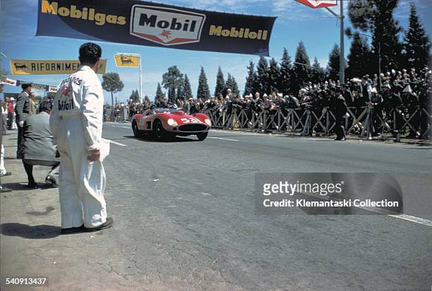 The Mille Miglia, May 11-12, 1957. Alfonso de Portago with his navigator Edmund Gurner Nelson accelerates away from the Rome control in fourth...