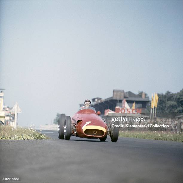 The German Grand Prix; Nürburgring, August 4, 1957. Juan Manuel Fangio braking into the South Curve during the early part of the race when he was far...