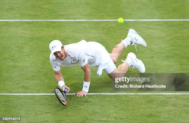 Andy Murray of Great Britain slips over as he reaches for the ball in his quarter final match against Kyle Edmund of Great Brtiain during day five of...