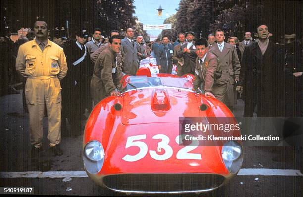 The Mille Miglia, May 11-12, 1957. Waiting for the start, the Ferrari mechanics push the car of von Trips toward the ramp.