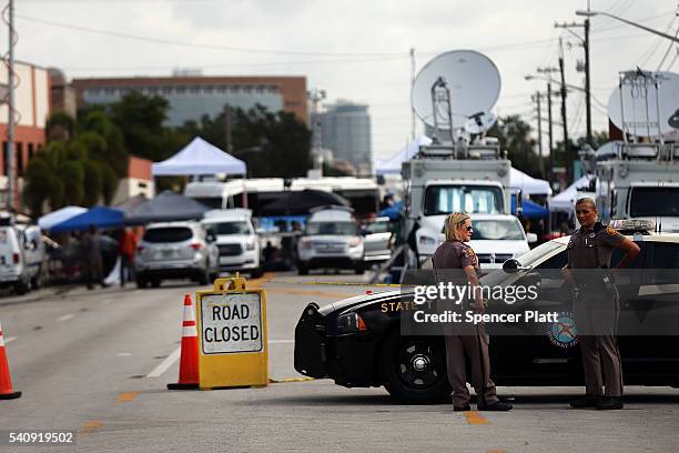 Police stand guard down the road from the Pulse nightclub on June 17, 2016 in Orlando, Florida. Omar Mir Seddique Mateen killed 49 people and wounded...