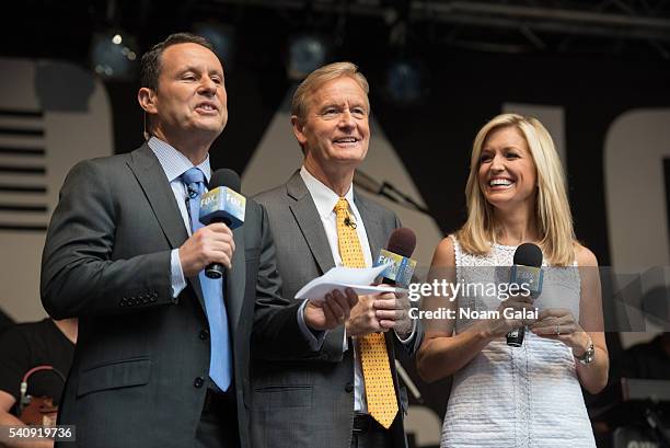 Brian Kilmeade, Steve Doocy and Ainsley Earhardt attend "FOX & Friends" All American Concert Series outside of FOX Studios on June 17, 2016 in New...