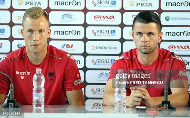 Albania's forward Bekim Balaj and Albania's defender Andi Lila hold a press conference at the team's training ground in Perros-Guirec, western...