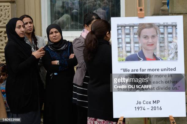Women queue outside Batley Town Hall in Batley, northern England on June 17, 2016 to sign a book of condolence for Labour MP Jo Cox was killed in a...