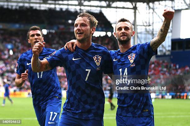 Ivan Rakitic of Croatia celebrates scoring his side's second goal with team-mate Marceloe Brozovic during the UEFA Euro 2016 Group D match between...