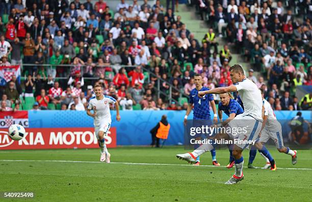 Tomas Necid of Czech Republic scores from the penalty spot to make the score 2-2 during the UEFA EURO 2016 Group D match between Czech Republic and...