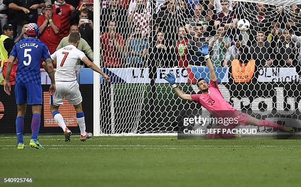 Czech Republic's forward Tomas Necid scores against Croatia's goalkeeper Danijel Subasic during the Euro 2016 group D football match between Czech...