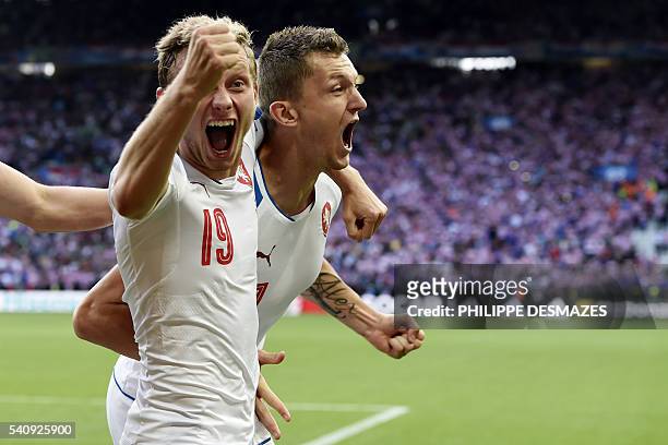 Czech Republic's forward Tomas Necid celebrates with Croatia's midfielder Milan Badelj after scoring during the Euro 2016 group D football match...
