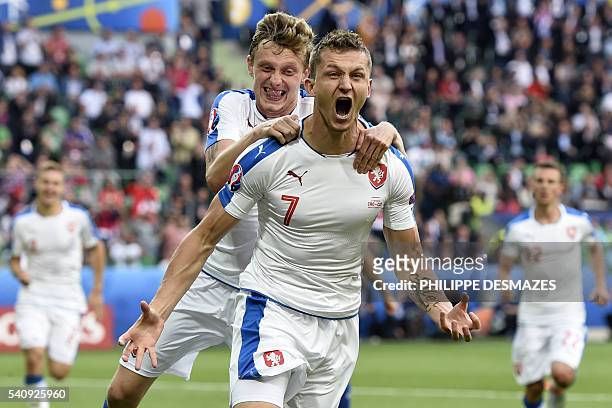 Czech Republic's forward Tomas Necid celebrates with Croatia's midfielder Milan Badelj after scoring during the Euro 2016 group D football match...