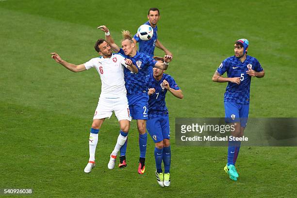 Domagoj Vida of Croatia jumps over Tomas Sivok of Czech Republic and handles the ball in box to give away a penalty during the UEFA EURO 2016 Group D...