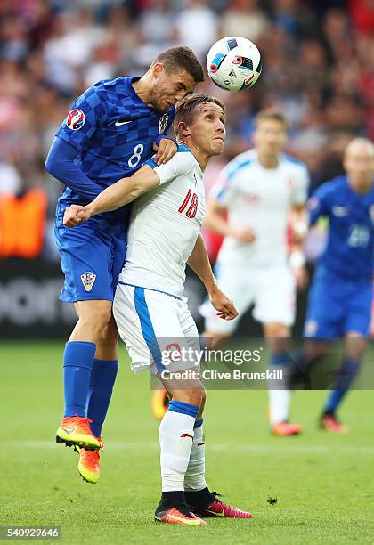 Mateo Kovacic of Croatia outjumps Josef Sural of Czech Republic during the UEFA EURO 2016 Group D match between Czech Republic and Croatia at Stade...