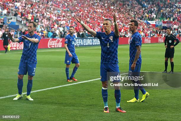 Ivan Perisic of Croatia and team-mate Ivan Rakitic appeal for calm during the UEFA Euro 2016 Group D match between the Czech Republic and Croatia at...