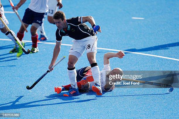 Oliver Korn of Germany and Nick Catlin of Great Britain get tangled up during the FIH Men's Hero Hockey Champions Trophy match between Belgium and...