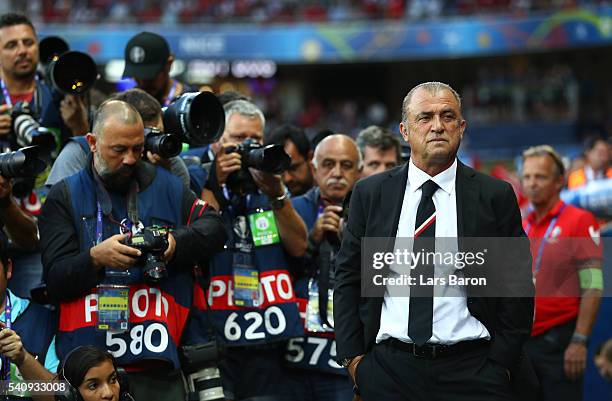 Photographers line up to photograph Fatih Terim head coach of Turkey during the UEFA EURO 2016 Group D match between Spain and Turkey at Allianz...