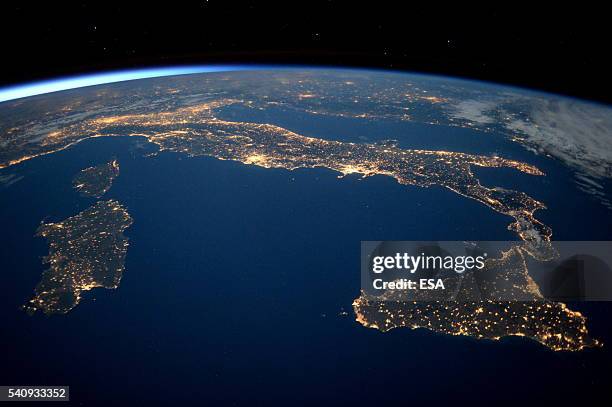 This handout image supplied by the European Space Agency , shows an aerial view over Italy at night from the International Space Station, on May 21,...