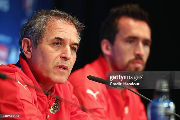 In this handout image provided by UEFA head coach Marcel Koller and Christian Fuchs of Austria attend a press conference at Parc des Princes on June...