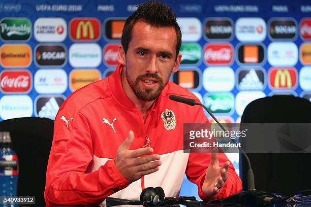 In this handout image provided by UEFA, Christian Fuchs of Austria talks during a press conference at Parc des Princes on June 17, 2016 in Paris,...