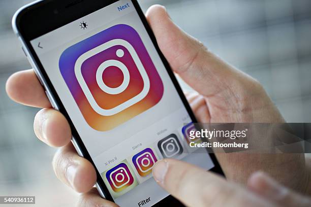 Facebook Inc.'s Instagram application is demonstrated on an Apple Inc. IPhone in this arranged photograph taken in Washington, D.C., U.S., on Friday,...