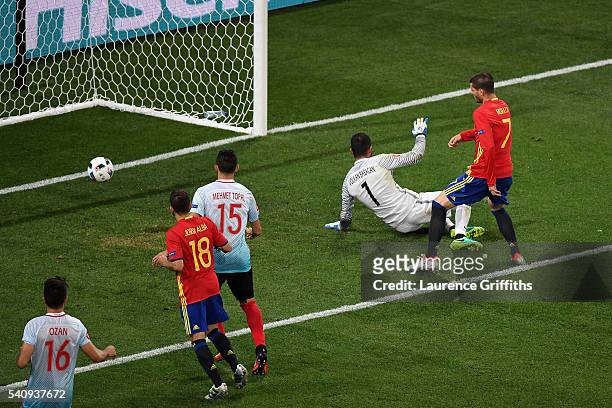 Alvaro Morata of Spain scores his sides third and his second goal past Volkan Babacan of Turkey during the UEFA EURO 2016 Group D match between Spain...