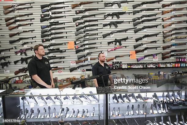 Guns built by DSA Inc and other manufacturers are displayed inside the DSA Inc. Store on June 17, 2016 in Lake Barrington, Illinois. Earlier in the...