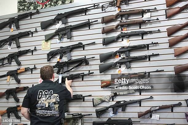 Guns built by DSA Inc and other manufacturers are displayed inside the DSA Inc. Store on June 17, 2016 in Lake Barrington, Illinois. Earlier in the...
