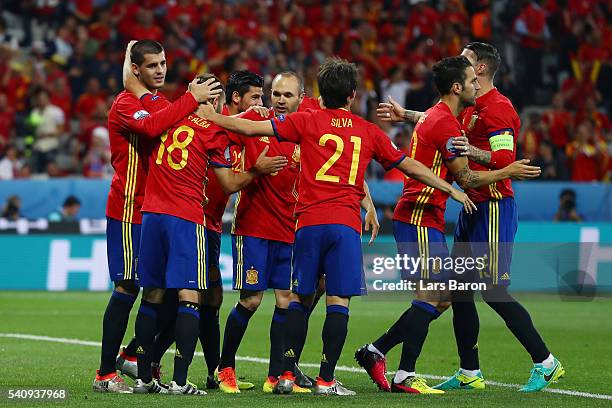 Alvaro Morata of Spain celebrates with team mates after scoring his second and his sides third goal during the UEFA EURO 2016 Group D match between...